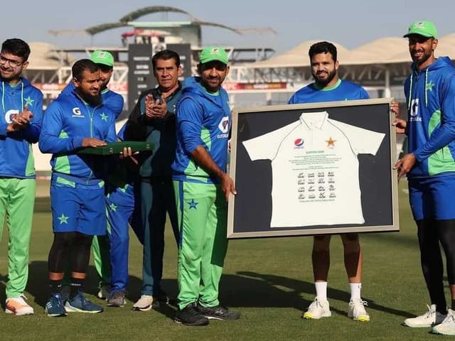 Azhar Ali receives a signed shirt and shield from teammates ahead final innings